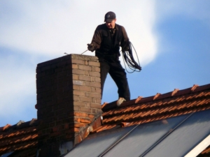 Chimney Inspection and Sweep being performed on woodbridge, va home