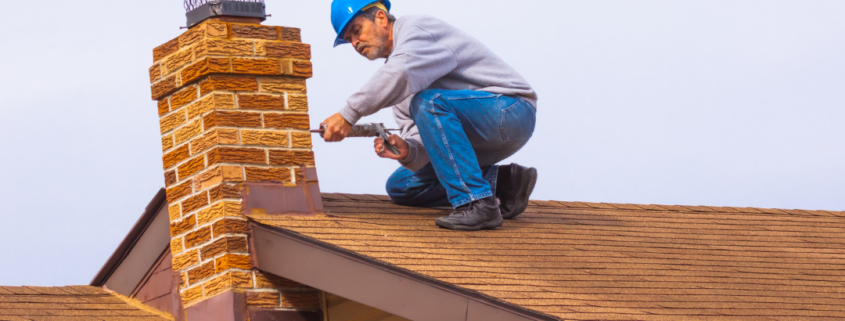 Professional chimney contractor from Six Penny Sweeps cleaning a chimney